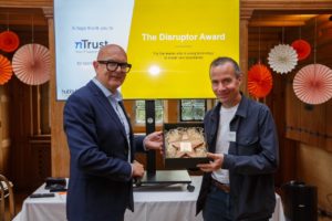 Russ McKenzie presents Disruptor Award to Davies Roberts