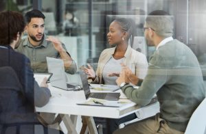 IT consultant discussing business phone system upgrade with company managers